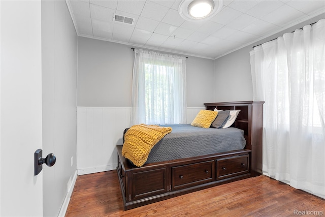 6917 Belton St, Garden City, MI 48135 - bedroom featuring wood finished floors, crown molding, and wainscoting