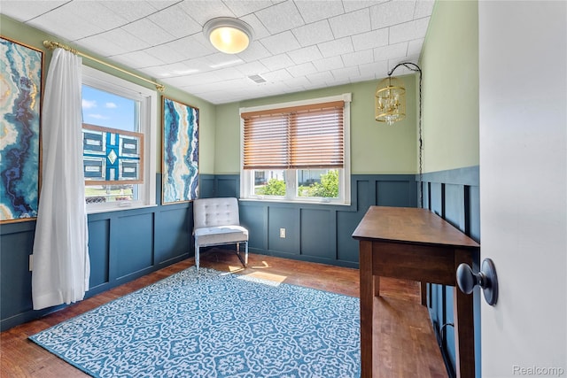 6917 Belton St, Garden City, MI 48135 - sitting room with healthy amount of natural light, wood finished floors, wainscoting, a decorative wall, and a chandelier