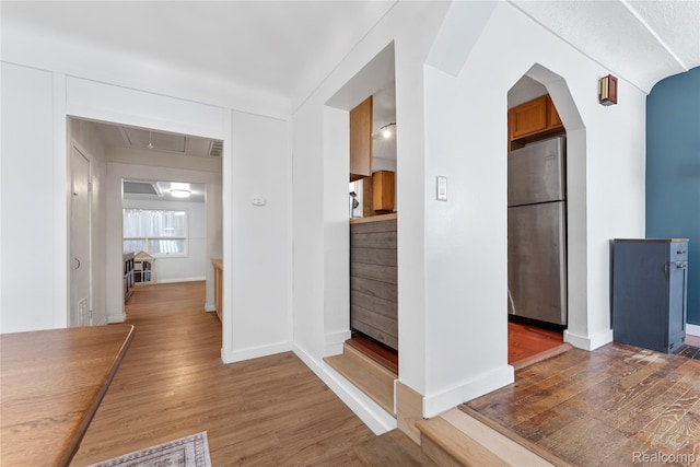 6917 Belton St, Garden City, MI 48135 - hallway with wood finished floors, attic access, and arched walkways