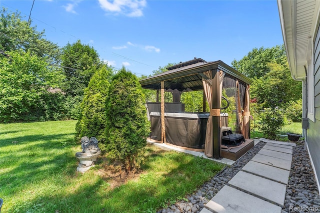 6917 Belton St, Garden City, MI 48135 - view of grassy yard with an outdoor hot tub and a gazebo