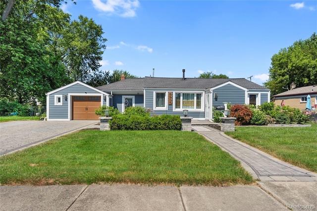 6917 Belton St, Garden City, MI 48135 - view of front of property featuring a front yard, asphalt driveway, a chimney, and an attached garage