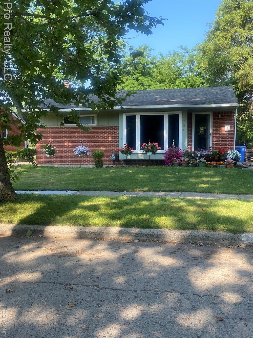 724 Clair St, Inkster, MI 48141 - view of front of house with brick siding and a front lawn