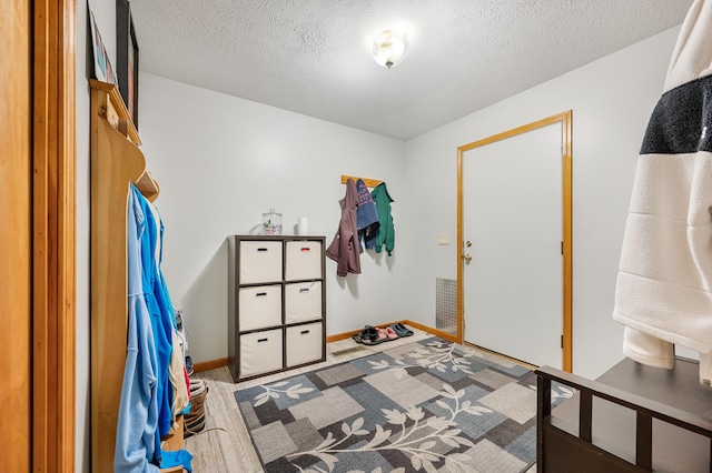 8361 9 Mile Rd, Big Rapids, MI 49307 - bedroom featuring a textured ceiling