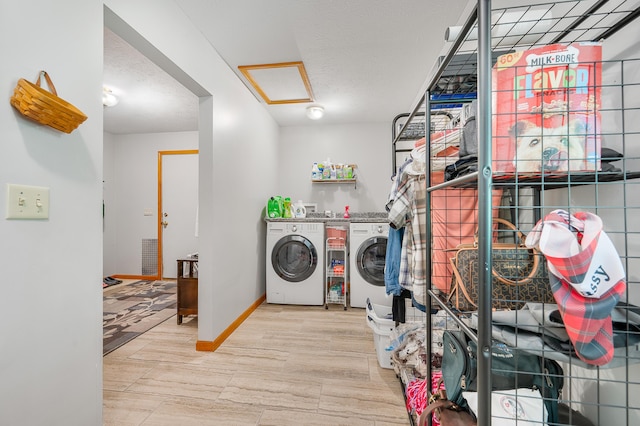 8361 9 Mile Rd, Big Rapids, MI 49307 - washroom featuring separate washer and dryer, light wood-style flooring, attic access, and a textured ceiling