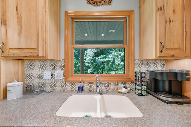 8361 9 Mile Rd, Big Rapids, MI 49307 - kitchen featuring light brown cabinetry, light countertops, and tasteful backsplash