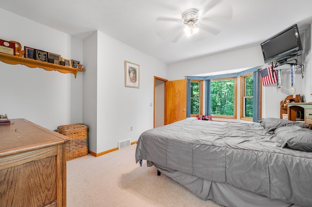 8361 9 Mile Rd, Big Rapids, MI 49307 - bedroom with carpet floors and a ceiling fan