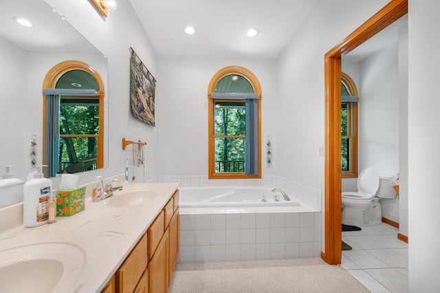 8361 9 Mile Rd, Big Rapids, MI 49307 - bathroom featuring double vanity, a garden tub, and recessed lighting