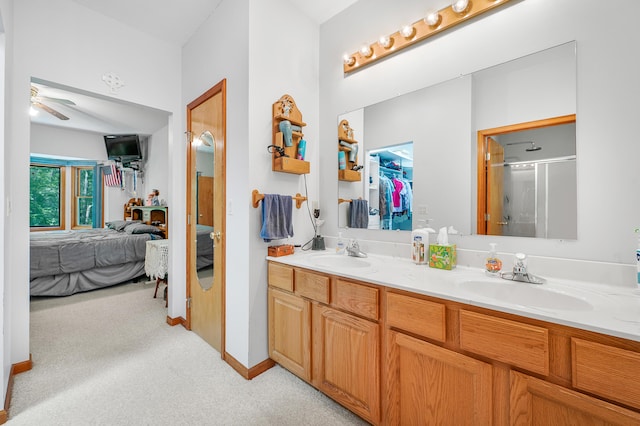 8361 9 Mile Rd, Big Rapids, MI 49307 - full bathroom with connected bathroom, double vanity, an enclosed shower, ceiling fan, and carpet