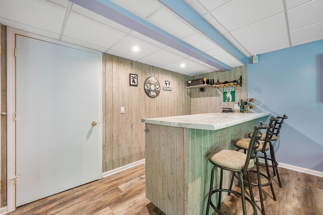 8361 9 Mile Rd, Big Rapids, MI 49307 - indoor dry bar featuring wooden walls, wood finished floors, and recessed lighting