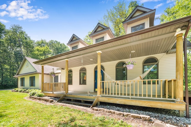 8361 9 Mile Rd, Big Rapids, MI 49307 - rear view of property with a porch and a yard