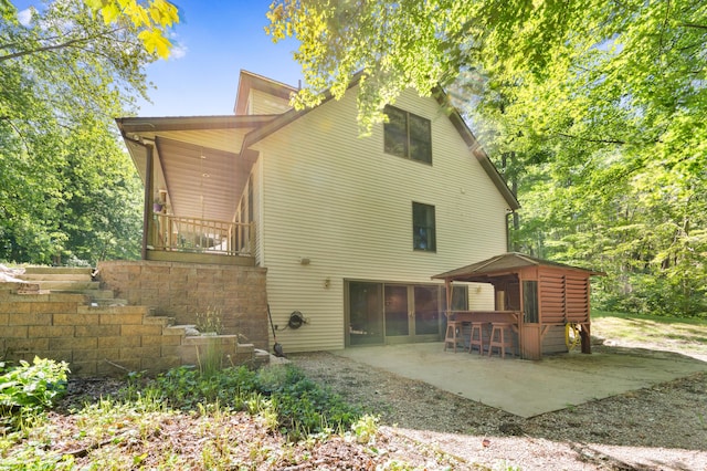 8361 9 Mile Rd, Big Rapids, MI 49307 - rear view of house featuring a patio