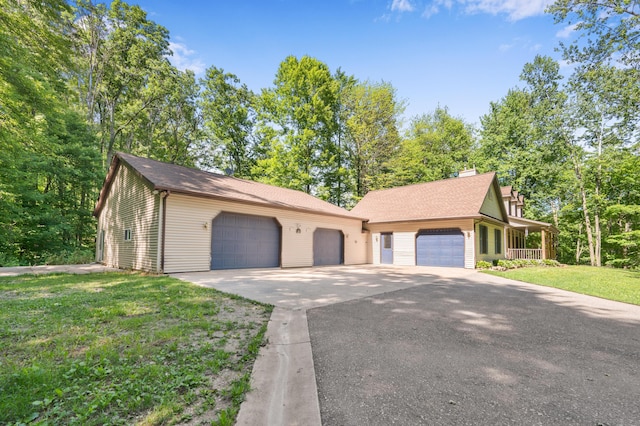 8361 9 Mile Rd, Big Rapids, MI 49307 - view of front facade with a front yard and a chimney
