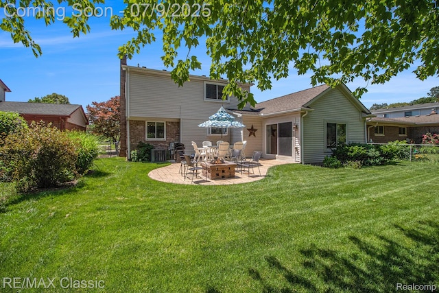 6706 Brookshire Dr, Canton, MI 48187 - back of property featuring a patio, a fire pit, and brick siding