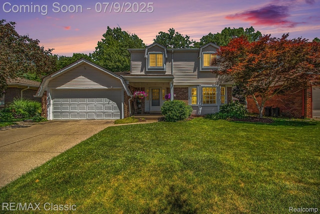 6706 Brookshire Dr, Canton, MI 48187 - traditional home featuring brick siding, an attached garage, a front lawn, and driveway
