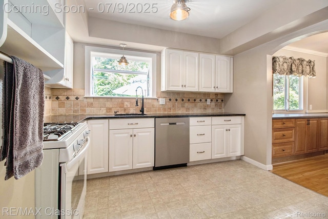 6706 Brookshire Dr, Canton, MI 48187 - kitchen featuring dishwasher, white gas range oven, white cabinetry, and plenty of natural light