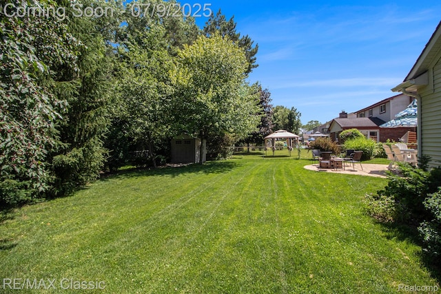 6706 Brookshire Dr, Canton, MI 48187 - view of green lawn with a gazebo, a shed, and a patio