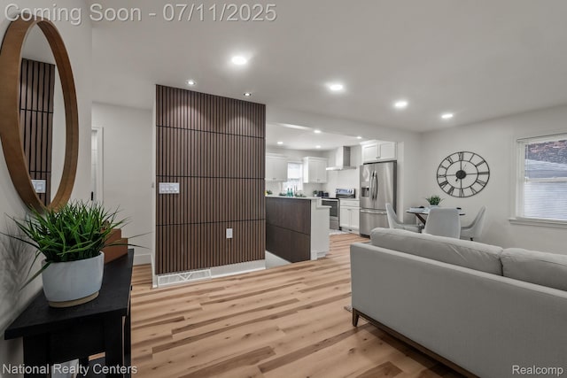 1089 Tecumseh Ave, Waterford, MI 48327 - living room with light wood-type flooring and recessed lighting