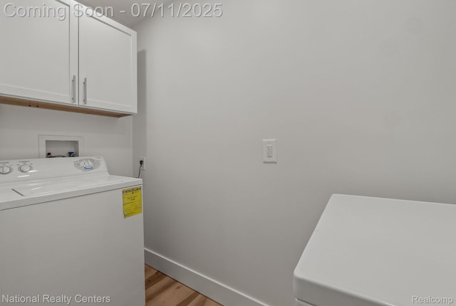 1089 Tecumseh Ave, Waterford, MI 48327 - laundry area featuring washer / clothes dryer, cabinet space, and light wood-style flooring