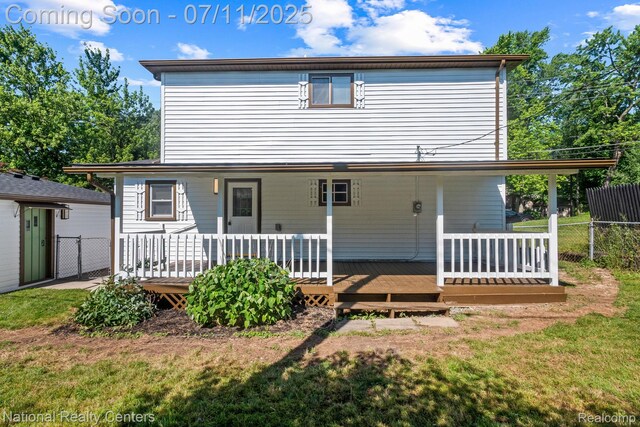 1089 Tecumseh Ave, Waterford, MI 48327 - back of property with a deck