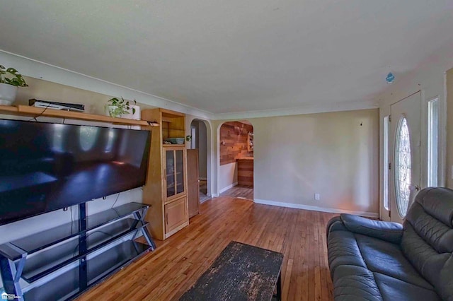 296 S Saginaw St, Montrose, MI 48457 - living room with arched walkways and wood finished floors