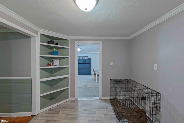 296 S Saginaw St, Montrose, MI 48457 - corridor featuring a textured ceiling, wood finished floors, built in features, and crown molding