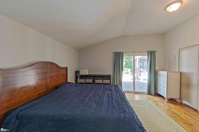 296 S Saginaw St, Montrose, MI 48457 - bedroom featuring access to exterior, light wood finished floors, and vaulted ceiling