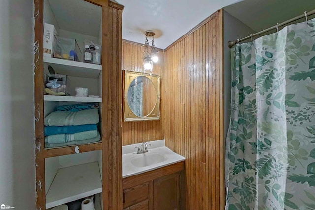 296 S Saginaw St, Montrose, MI 48457 - bathroom with vanity, curtained shower, and wood walls