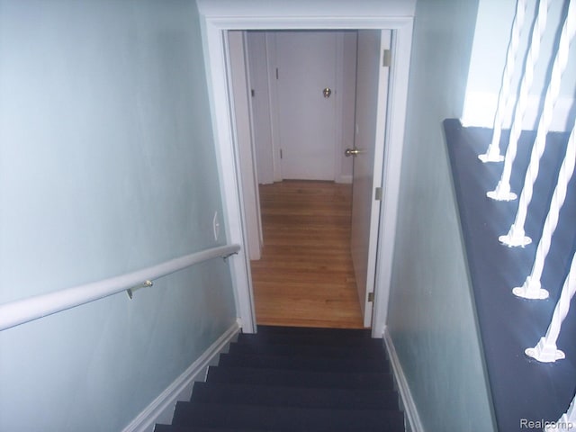 20003 Lichfield Rd, Detroit, MI 48221 - staircase with wood finished floors and baseboards