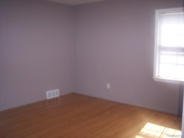 20003 Lichfield Rd, Detroit, MI 48221 - empty room featuring wood finished floors