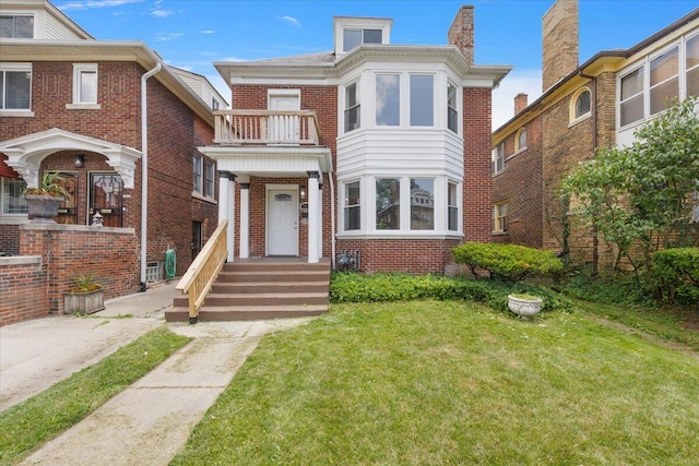 2475 Hazelwood St, Detroit, MI 48206 - view of front of house with a balcony, a front lawn, and brick siding