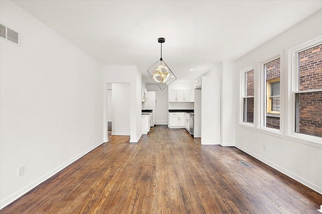 2475 Hazelwood St, Detroit, MI 48206 - unfurnished dining area with dark wood-type flooring and recessed lighting
