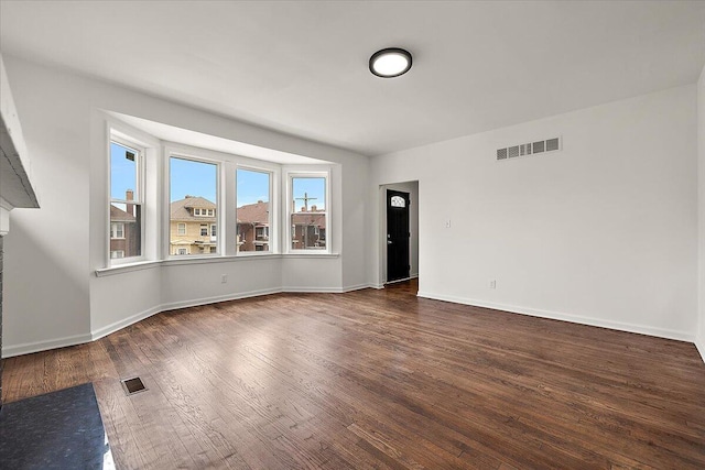 2475 Hazelwood St, Detroit, MI 48206 - spare room featuring dark wood-type flooring and baseboards