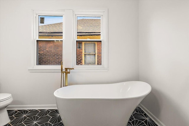 2475 Hazelwood St, Detroit, MI 48206 - full bathroom featuring a freestanding bath and tile patterned floors
