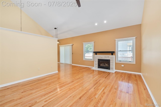 57349 Megan Dr, Washington, MI 48094 - unfurnished living room with a fireplace, wood finished floors, a ceiling fan, high vaulted ceiling, and recessed lighting