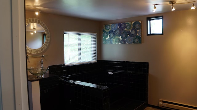 13558 Asbury Park, Detroit, MI 48227 - full bath with a baseboard radiator, vanity, and a relaxing tiled tub