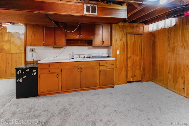 13776 Leroy St, Southgate, MI 48195 - kitchen with light carpet, wood walls, light countertops, open shelves, and fridge
