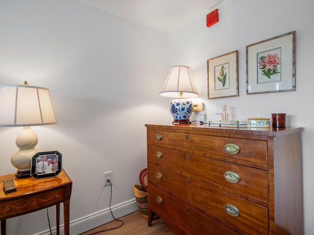 111 N Ashley St Unit 513, Ann Arbor, MI 48104 - bedroom with wood finished floors and a baseboard radiator