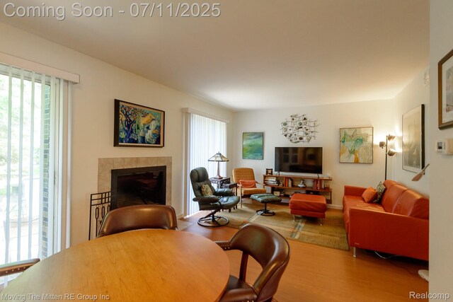 2746 Page Ave, Ann Arbor, MI 48104 - living area featuring healthy amount of natural light, a tile fireplace, and wood finished floors