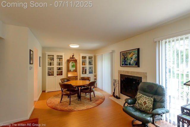 2746 Page Ave, Ann Arbor, MI 48104 - dining area with a fireplace and wood finished floors