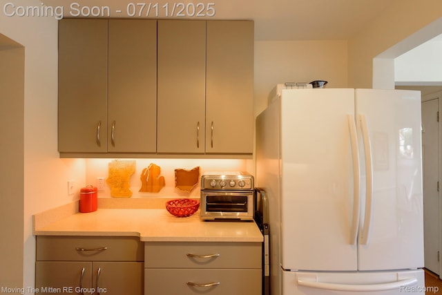 2746 Page Ave, Ann Arbor, MI 48104 - kitchen featuring freestanding refrigerator, light countertops, and gray cabinets