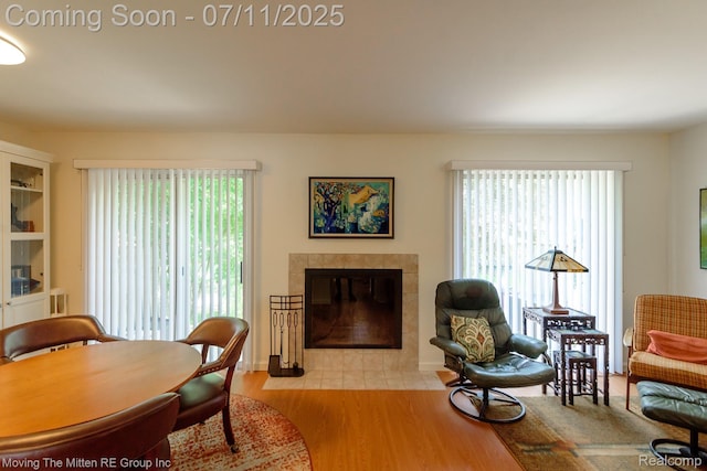 2746 Page Ave, Ann Arbor, MI 48104 - living area with wood finished floors, a tile fireplace, and plenty of natural light
