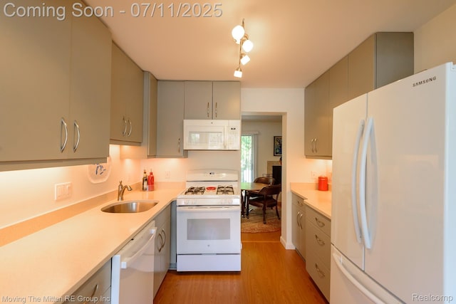 2746 Page Ave, Ann Arbor, MI 48104 - kitchen featuring white appliances, light wood-style floors, gray cabinetry, and light countertops