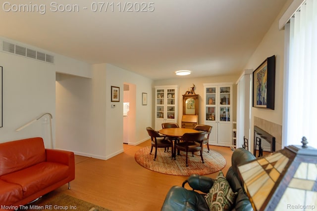 2746 Page Ave, Ann Arbor, MI 48104 - dining room featuring light wood finished floors and a tiled fireplace