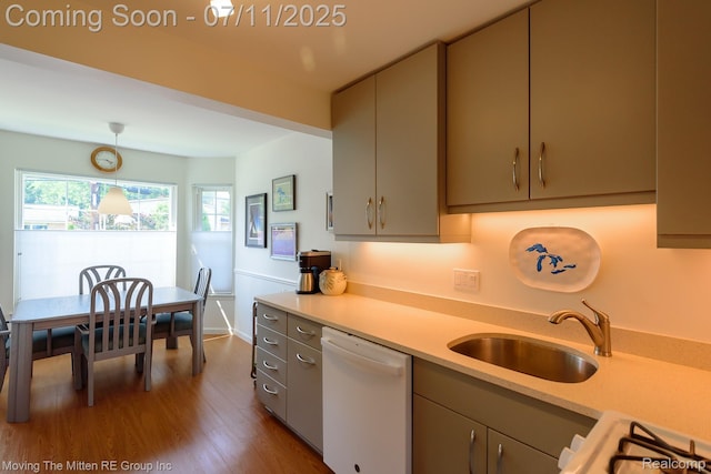 2746 Page Ave, Ann Arbor, MI 48104 - kitchen with dishwasher, light countertops, dark wood finished floors, and pendant lighting