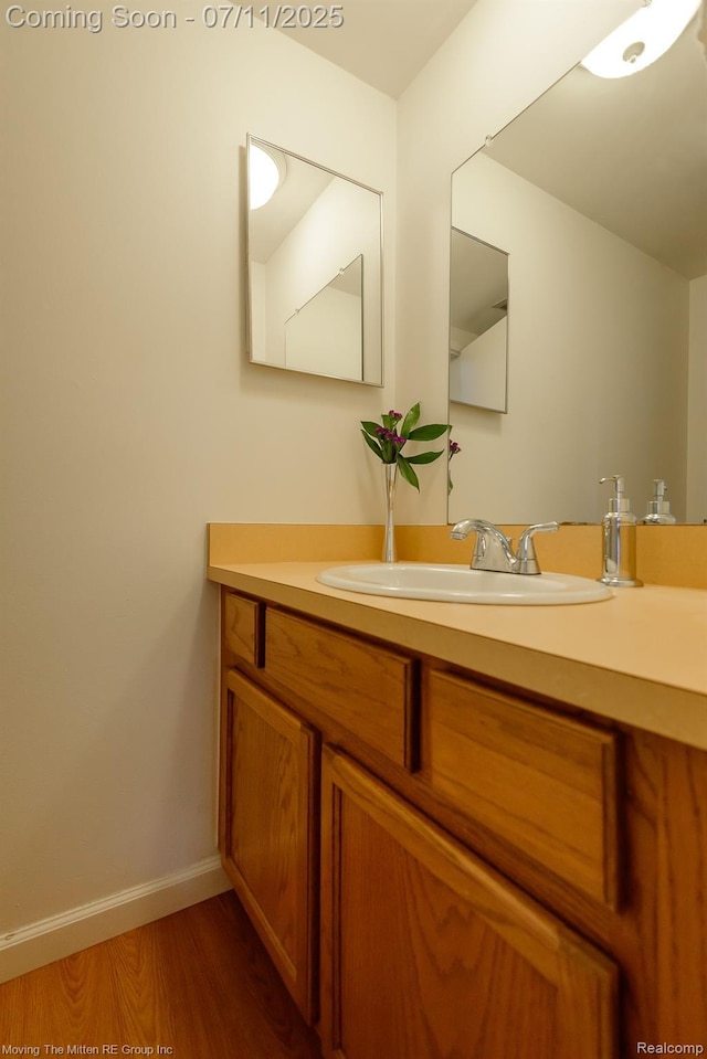 2746 Page Ave, Ann Arbor, MI 48104 - bathroom featuring vanity and wood finished floors