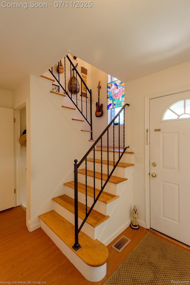 2746 Page Ave, Ann Arbor, MI 48104 - foyer entrance with stairway, wood finished floors, and plenty of natural light