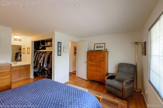 2746 Page Ave, Ann Arbor, MI 48104 - bedroom featuring light wood-style flooring, a closet, and multiple windows