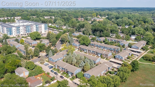 2746 Page Ave, Ann Arbor, MI 48104 - aerial view of property and surrounding area with a heavily wooded area
