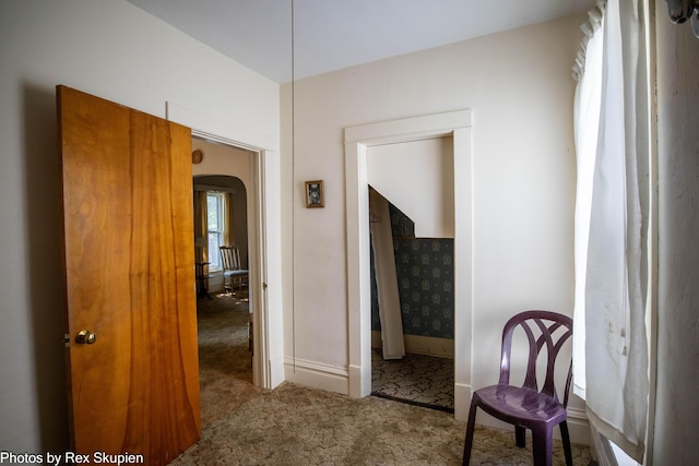 892 W Forest Ave, Muskegon, MI 49441 - hall with carpet and arched walkways