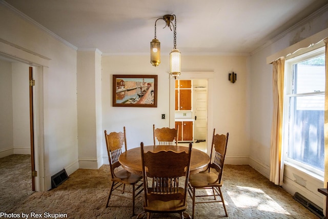 892 W Forest Ave, Muskegon, MI 49441 - carpeted dining area with ornamental molding and baseboards